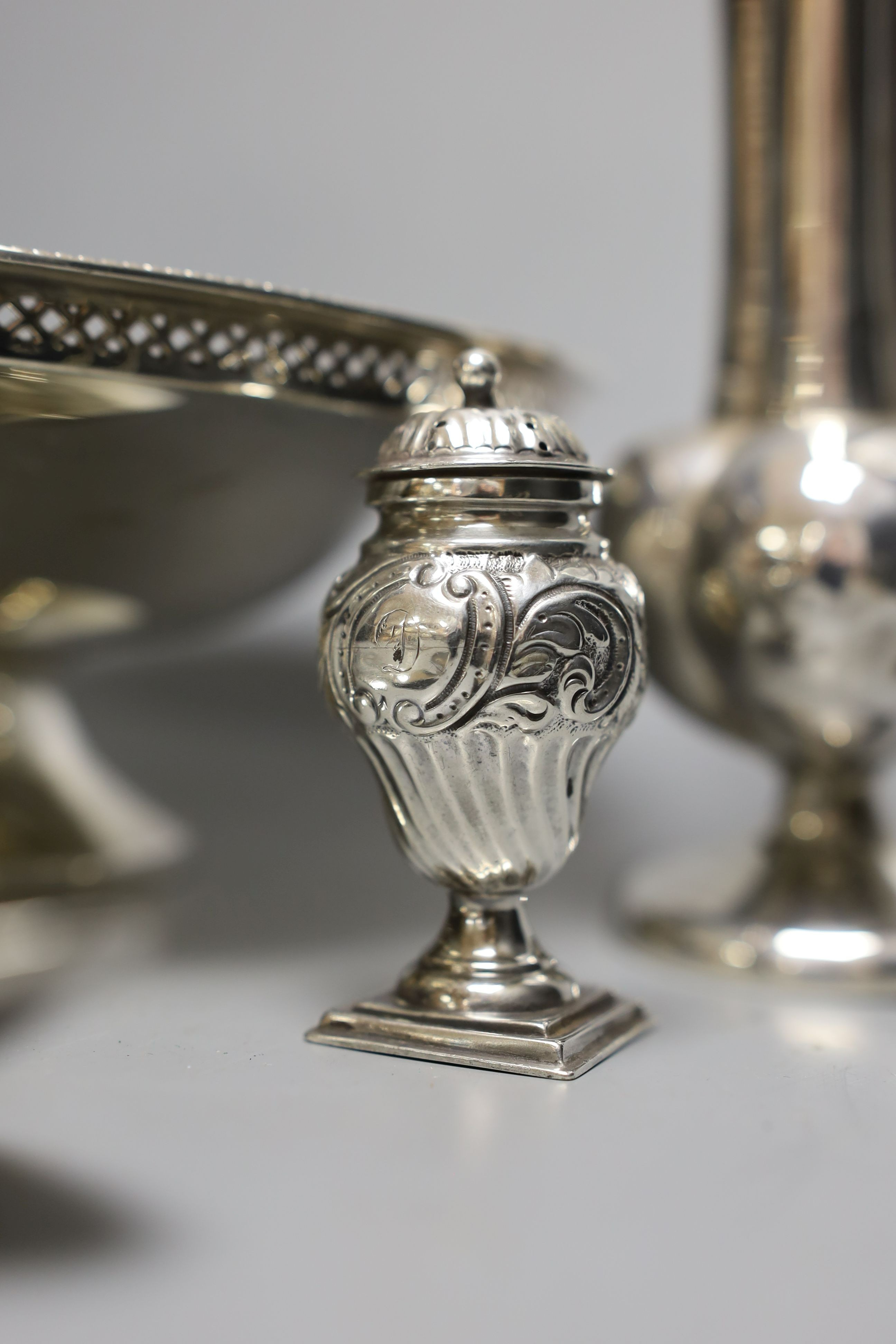 A George V silver bowl, by Walker & Hall, a pair of vases, pair of George III silver table spoons, one other spoon and a pepperette.